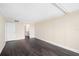 Open bedroom featuring hardwood floors, neutral walls and an entrance to the bathroom at 3211 W Swann Ave # 605, Tampa, FL 33609