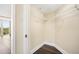 Well-organized walk-in closet featuring wire shelving, hardwood floors and neutral walls at 3211 W Swann Ave # 605, Tampa, FL 33609
