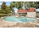 Community pool surrounded by lush landscaping and lounge chairs at 3211 W Swann Ave # 605, Tampa, FL 33609