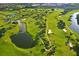 Lush green golf course with winding fairways and tranquil ponds offers a picturesque landscape at 339 Club Manor Dr, Sun City Center, FL 33573