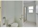 Clean bathroom with a toilet, walk-in shower, and a small window for natural light at 339 Club Manor Dr, Sun City Center, FL 33573