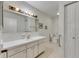 Bathroom featuring floral wallpaper, tile flooring and vanity at 339 Club Manor Dr, Sun City Center, FL 33573
