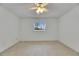 Carpeted bedroom featuring a ceiling fan and bright windows at 339 Club Manor Dr, Sun City Center, FL 33573