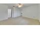Spacious bedroom featuring neutral carpet, ceiling fan, and plenty of natural light at 339 Club Manor Dr, Sun City Center, FL 33573