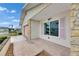Home exterior featuring stone accents, tidy landscaping, and a quaint, welcoming facade at 339 Club Manor Dr, Sun City Center, FL 33573