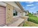 Exterior of charming single-story home with stone accents and well-maintained landscaping at 339 Club Manor Dr, Sun City Center, FL 33573