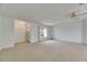 Bright living room featuring neutral carpet, a large window, and a classic ceiling fan at 339 Club Manor Dr, Sun City Center, FL 33573
