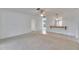 Bright living room with an open bar and neutral carpeting at 339 Club Manor Dr, Sun City Center, FL 33573