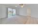 Bright living area with sliding glass doors to the lanai and tile flooring in transition area at 339 Club Manor Dr, Sun City Center, FL 33573