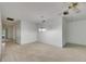 Bright living room featuring neutral carpeting and a modern ceiling fan at 339 Club Manor Dr, Sun City Center, FL 33573