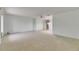 Bright, open living room featuring neutral carpet, ceiling fan, and abundant natural light at 339 Club Manor Dr, Sun City Center, FL 33573
