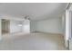 Spacious living area with neutral carpet, ceiling fan, and ample natural light at 339 Club Manor Dr, Sun City Center, FL 33573