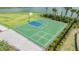 Overhead shot of a community basketball court with green playing surface and black fence at 33922 Jasper Stone Dr, Wesley Chapel, FL 33543