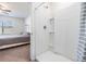 Ensuite bathroom featuring a modern shower with glass door, neutral tones, and ample space at 33922 Jasper Stone Dr, Wesley Chapel, FL 33543