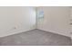 Neutral-toned bedroom with carpet, window, and room for furnishings at 33922 Jasper Stone Dr, Wesley Chapel, FL 33543