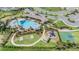 Aerial view showcasing community amenities including a pool, playground, basketball court and clubhouse at 33922 Jasper Stone Dr, Wesley Chapel, FL 33543
