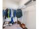 Walk-in closet featuring ample hanging space and shelving for organized storage at 33922 Jasper Stone Dr, Wesley Chapel, FL 33543
