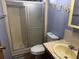 Cozy bathroom featuring a walk-in shower and a vanity sink at 34300 Countryside Dr, Wesley Chapel, FL 33543