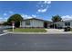 Well-maintained home with covered parking and manicured landscaping, located on a corner lot at 34300 Countryside Dr, Wesley Chapel, FL 33543