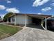 Well-maintained home with covered parking and manicured landscaping, located on a corner lot at 34300 Countryside Dr, Wesley Chapel, FL 33543