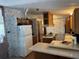 Cozy kitchen featuring light-colored counters, white appliances and wooden cabinetry at 34300 Countryside Dr, Wesley Chapel, FL 33543