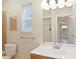 Bright bathroom showcasing a modern vanity, a well-lit mirror, and neutral color palette at 345 21St S Ave, St Petersburg, FL 33705