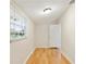 Cozy bedroom with light hardwood floors, white walls, a bright window, and ample natural light at 345 21St S Ave, St Petersburg, FL 33705