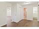 Hallway with wood-look flooring leads to various rooms in the house at 345 21St S Ave, St Petersburg, FL 33705
