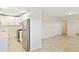 Modern kitchen features new cabinets, stainless steel appliances, and tile flooring at 345 21St S Ave, St Petersburg, FL 33705