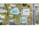 Overhead view of community amenities including a pool, shuffleboard, bocce ball and clubhouse at 3542 Castle Dr, Zephyrhills, FL 33540
