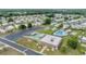 Community aerial view highlighting amenities including pool, shuffleboard, and clubhouse at 3542 Castle Dr, Zephyrhills, FL 33540