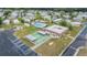Aerial shot of the shuffleboard courts, clubhouse and swimming pool for this community at 3542 Castle Dr, Zephyrhills, FL 33540