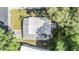 Aerial view showcasing the roof and surrounding greenery at 3542 Castle Dr, Zephyrhills, FL 33540