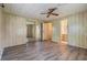 Spacious bedroom with wood-look flooring and mirrored closet at 3542 Castle Dr, Zephyrhills, FL 33540