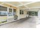 Spacious carport featuring a screened-in porch and convenient access to the home at 3542 Castle Dr, Zephyrhills, FL 33540