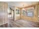 Cozy dining area with wood-style floors and natural light from the window at 3542 Castle Dr, Zephyrhills, FL 33540
