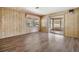 Comfortable living room with sliding doors leading to the sunroom and backyard at 3542 Castle Dr, Zephyrhills, FL 33540