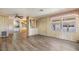 Open living room featuring stylish flooring and abundant natural light at 3542 Castle Dr, Zephyrhills, FL 33540