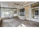 Inviting screened porch featuring a ceiling fan and easy access to the home at 3542 Castle Dr, Zephyrhills, FL 33540