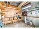 Functional storage shed interior with workbench and shelving at 3542 Castle Dr, Zephyrhills, FL 33540