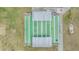 Overhead shot of the community shuffleboard courts; each lane is covered and has benches at 3542 Castle Dr, Zephyrhills, FL 33540