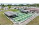 Overhead view of the community shuffleboard courts featuring multiple lanes and covered seating areas at 3542 Castle Dr, Zephyrhills, FL 33540