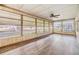 Spacious sunroom with large windows offering scenic views and ample natural light at 3542 Castle Dr, Zephyrhills, FL 33540