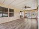 Bright sunroom with new floors, perfect for relaxing and enjoying natural light at 3542 Castle Dr, Zephyrhills, FL 33540