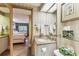Bathroom with granite countertops leading to bedroom with two beds and view of outdoor scenery at 36750 Us 19 N # 08204, Palm Harbor, FL 34684