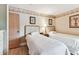 Bedroom featuring two beds and leaf designed decorations with a door on the left at 36750 Us 19 N # 08204, Palm Harbor, FL 34684