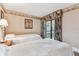 Bedroom featuring two beds with leaf designed decorations and view from balcony at 36750 Us 19 N # 08204, Palm Harbor, FL 34684