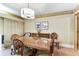 Dining room featuring wood flooring, a chandelier, and elegant decor at 36750 Us 19 N # 08204, Palm Harbor, FL 34684