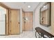 Welcoming entryway featuring tile flooring, a mirror, and neutral decor at 36750 Us 19 N # 08204, Palm Harbor, FL 34684