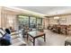 Bright living room featuring a sliding glass door to patio, and elegant decor at 36750 Us 19 N # 08204, Palm Harbor, FL 34684
